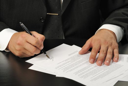 The businessman the signing contract. The man of the European nationality.