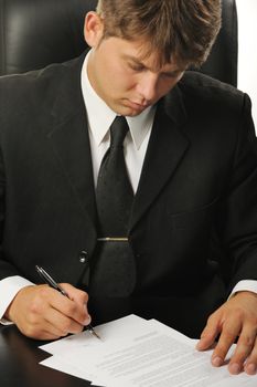 The businessman the signing contract. The man of the European nationality.