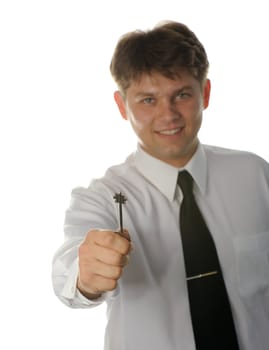 The young businessman with a key in a hand. It is isolated on a white background