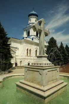 Cross - a fountain in orthodox laurels. Svyatogorsk laurels. Ukraine