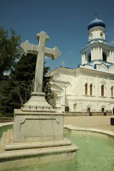 Cross - a fountain in orthodox laurels. Svyatogorsk laurels. Ukraine