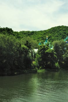 Picturesque forest and the river. Small river at bottom of mountain with mixed by a wood in the East Europe. Ukraine.