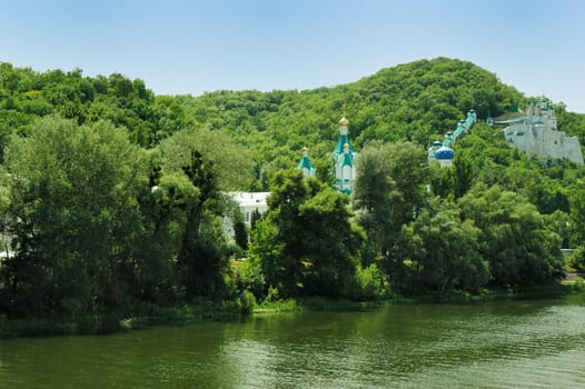 Picturesque forest and the river. Small river at bottom of mountain with mixed by a wood in the East Europe. Ukraine.