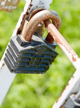 Old padlock. Iron, rusty lock on blur a background