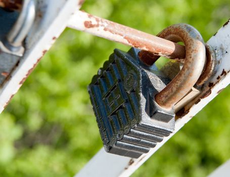 Old padlock. Iron, rusty lock on blur a background