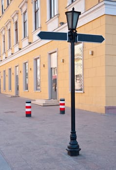 signpost. The street sign which specifies a direction of movement