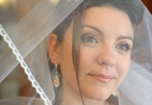 The bride. The young girl in a wedding dress on an abstract background