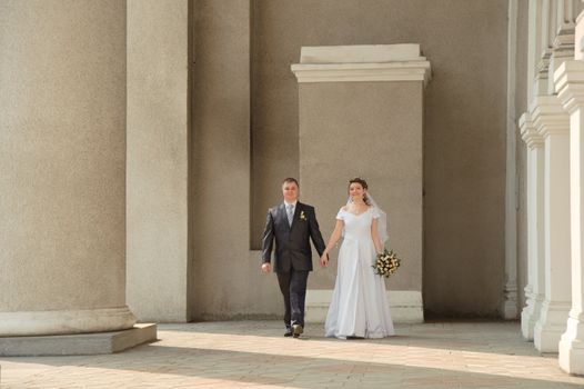 Newly-married couple. Pair young men in wedding day