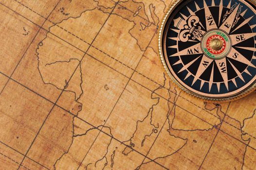 Old compass and map background. Old gold color