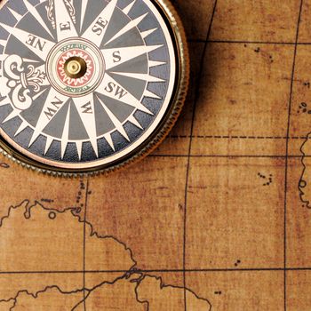 Old compass and map background. Old gold color