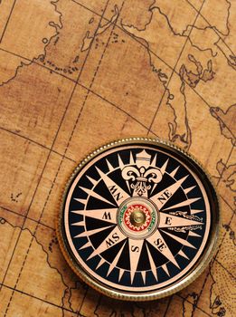 Old compass and map background. Old gold color