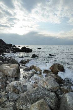 Splash of waves about coastal stones. Crimea, Ukraine