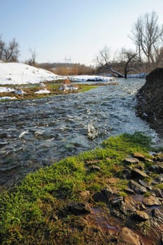 The spring river. A rough stream after a spring thawing weather