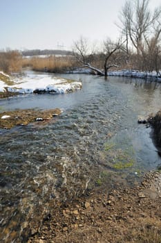 The spring river. A rough stream after a spring thawing weather