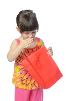 The little girl with color package. It is isolated on a white background