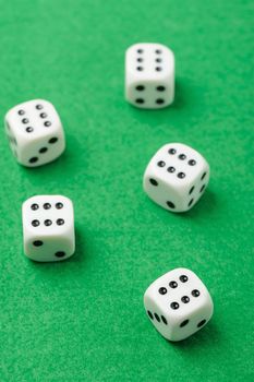 dices. Game cubes on a green background