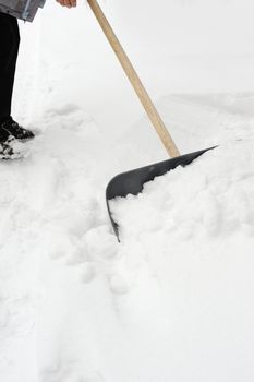 Cleaning of a snow. Clearing of road to winter time by means of a shovel