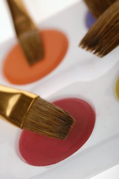 Paintbrush and paint. Brushes for drawing. C blur a color background