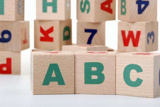 The alphabet. Letters drawn on wooden cubes. A children's toy