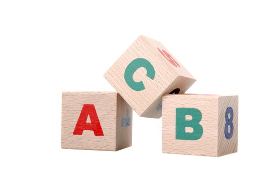 The alphabet. Letters drawn on wooden cubes. A children's toy