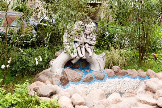 A statues in a summer garden
