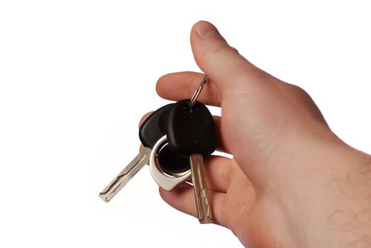Keys from the car. The isolated sheaf of keys from the car in a hand