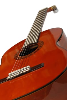 Guitar. An acoustic six-string guitar isolated by a plot a background

