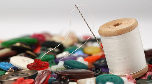 Needle and a thread. A set of accessories for sewing.