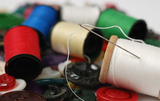 Needle and a thread. A set of accessories for sewing.