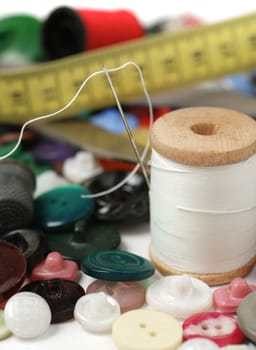 Needle and a thread. A set of accessories for sewing.