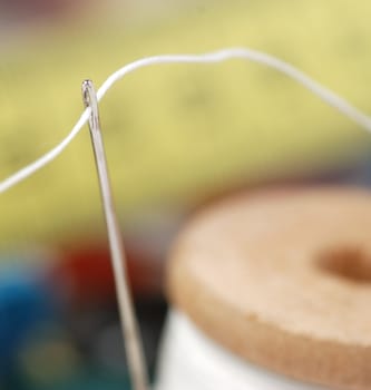 Needle and a thread. A set of accessories for sewing.