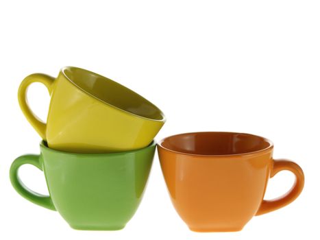 three color cups. Ceramic service from color cups