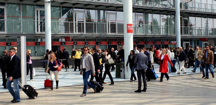 People at the exhibition entrance, Salone del Mobile, international furnishing accessories exhibition in Milan, Italy.