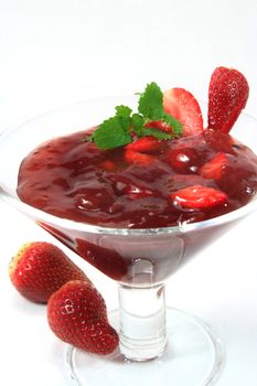 Red fruit jelly with strawberries and lemon balm