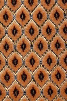 Detailed textured pattern of the textile of an old chair