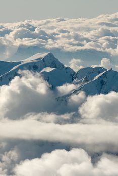 High mountain landscape above the clouds