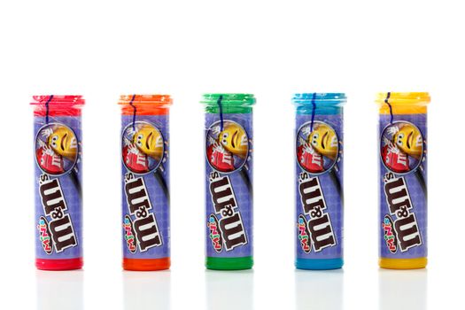 Five sealed coloured tubes containing M&M minis.  A smaller version of the traditional M&M chocolate candy.  Over 100 minis in each tube.  White background.  Editorial Use Only.