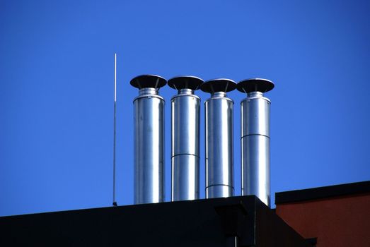 Four metal pipes are located in one line