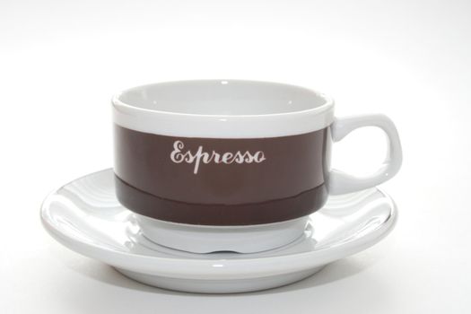 coffee cup with saucer with espresso printed on cup