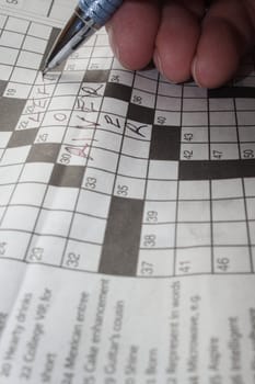 relaxing by doing a crossword puzzle