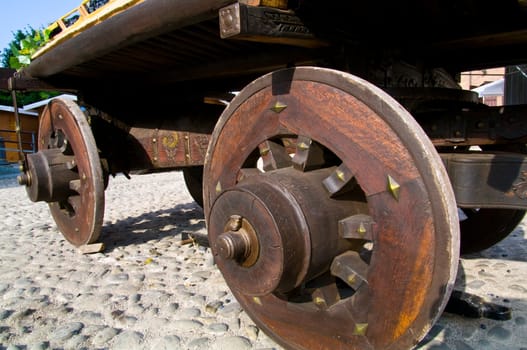 An old wagon with wooden wheels loaded with grapes