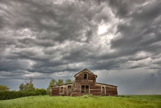 Abandoned Farm Buildings Saskatchewan Canada Storm clouds Prairie