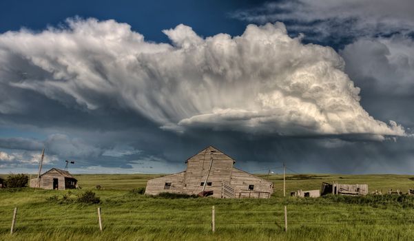 Abandoned Farm Buildings Saskatchewan Canada Storm clouds Prairie