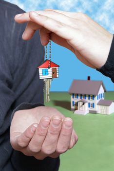 A conceptual image of someone receiving their key to their new home.