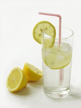 soda water with ice and lemon slices for hot day