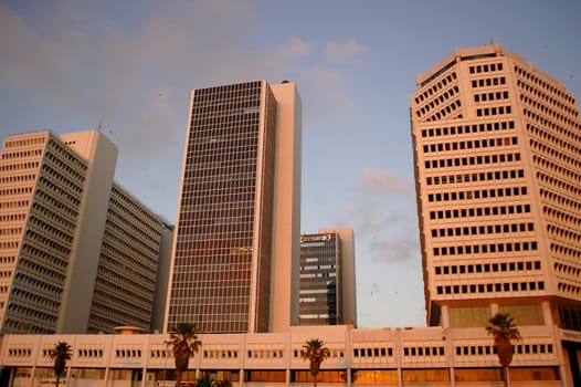 Taken in Israel with the sunset light hitting the business district.