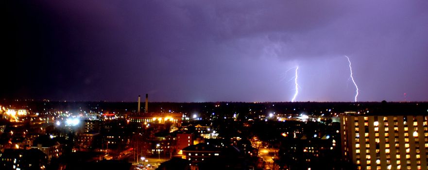 Lightining coming down in the city of Champaign, IL.