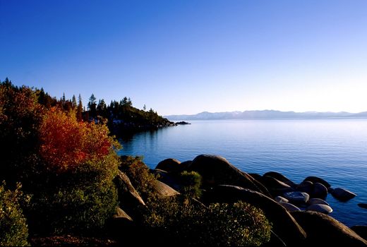 Lake Tahoe is a large freshwater lake in the Sierra Nevada mountains of the United States. It is located along the border between California and Nevada, west of Carson City, Nevada. The lake is known for the clarity of its water and the panorama of surrounding mountains on all sides.