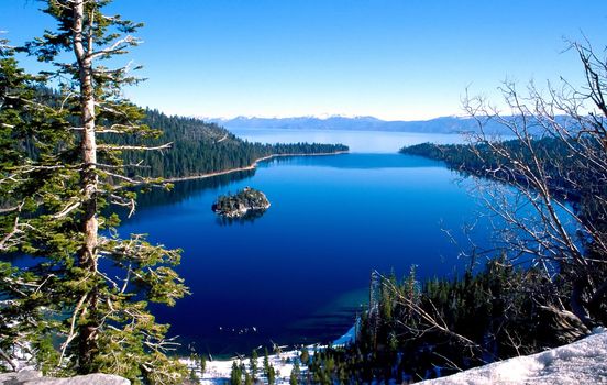 Lake Tahoe is a large freshwater lake in the Sierra Nevada mountains of the United States. It is located along the border between California and Nevada, west of Carson City, Nevada. The lake is known for the clarity of its water and the panorama of surrounding mountains on all sides.