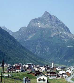 Swiss village with Alps in background